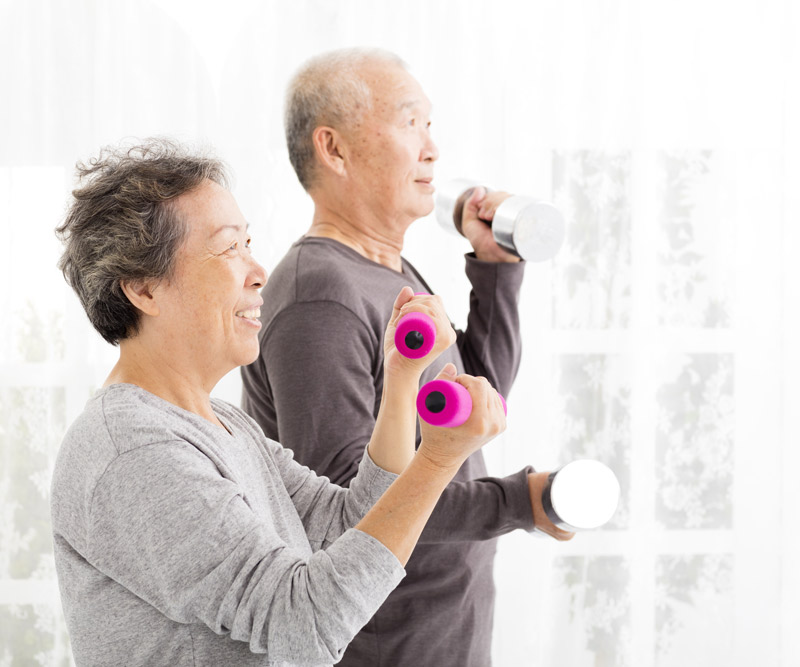 an elderly couple working out together