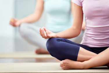 Two women meditating