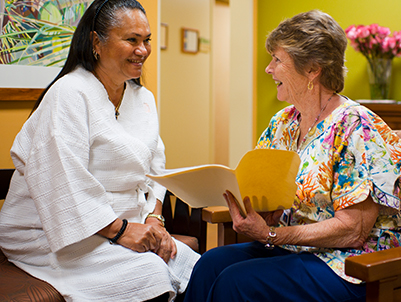 Doctor showing a patient a file of images