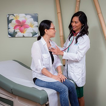 Doctor listening to patient heartbeat with stethascope