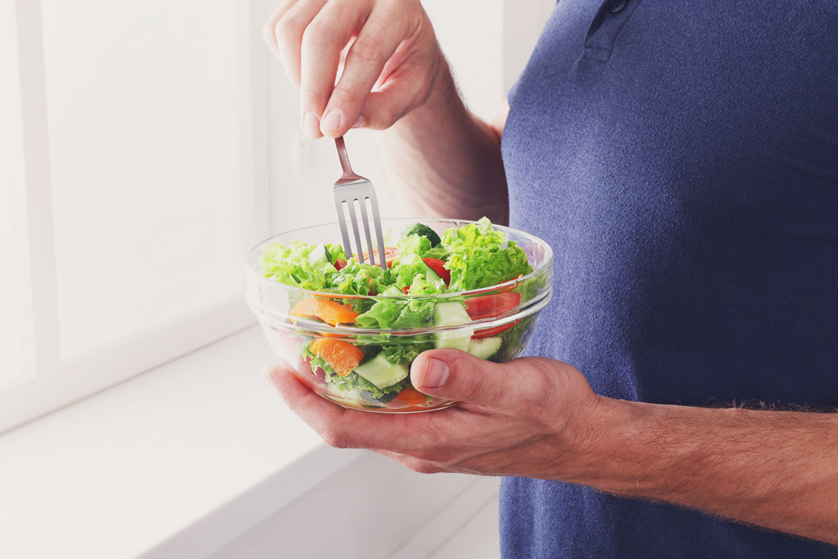 Person eating a healthy salad