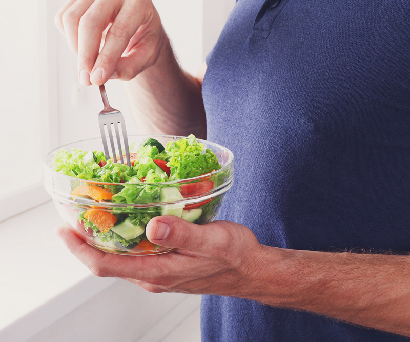 person eating a healthy salad