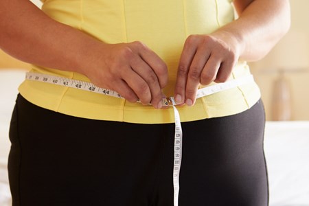 One symptom of metabolic syndrome? Carrying your weight in your midsection. If your waist measures more than 35 inches (for women) or 40 inches (for men), talk with your physician about developing the best weight-loss plan for you.