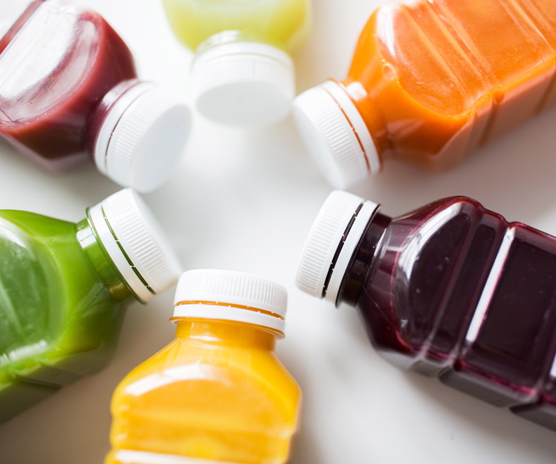 Various colored juice bottles