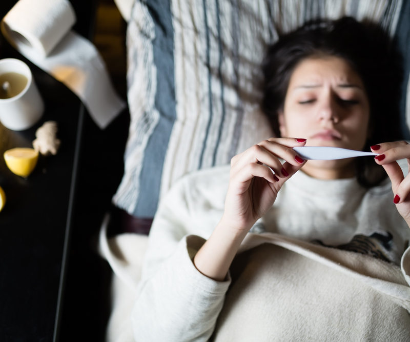 Person lying on bed