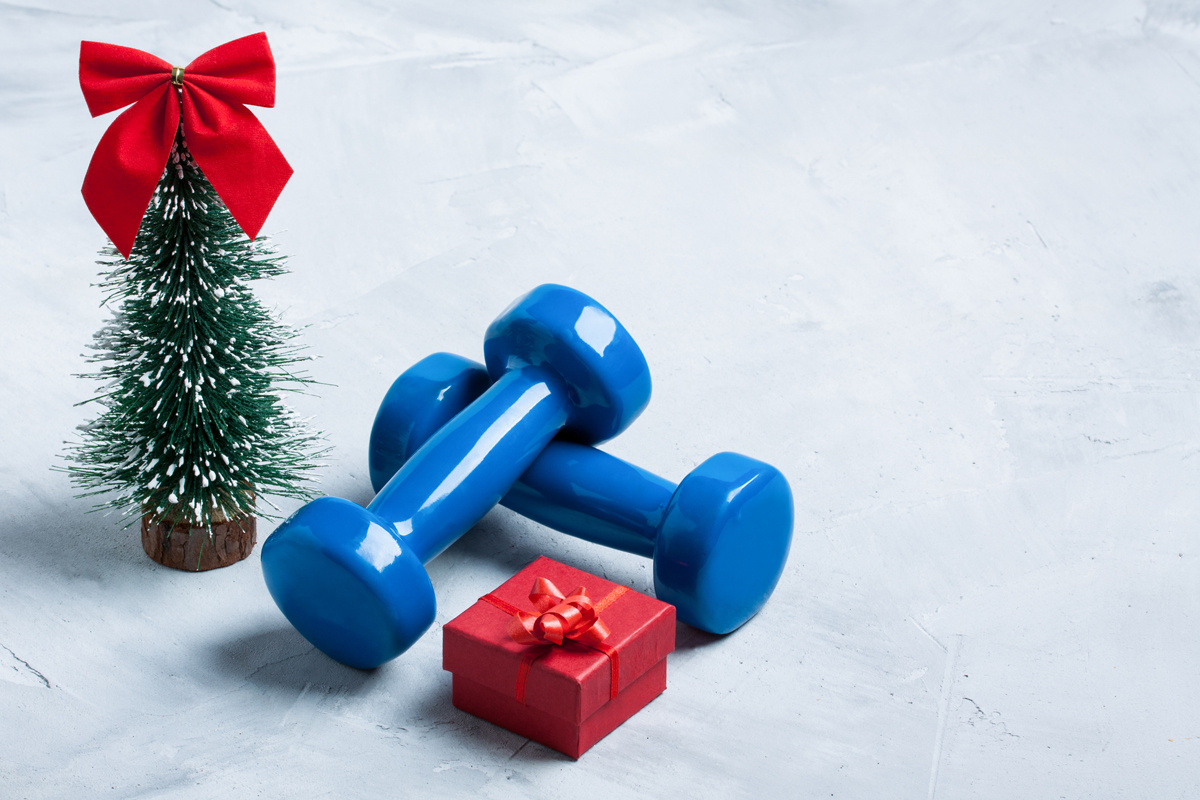 Workout gears next to small Christmas tree