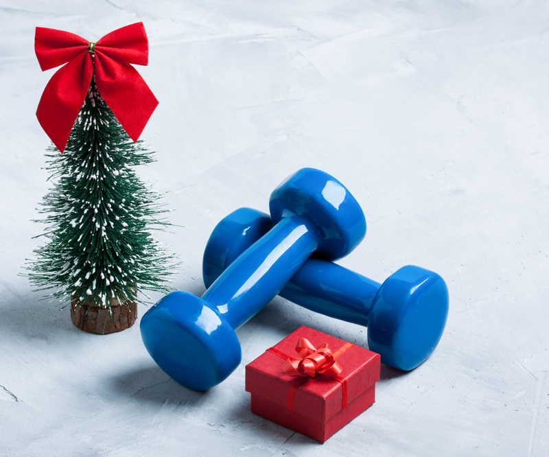 workout gears next to small Christmas tree