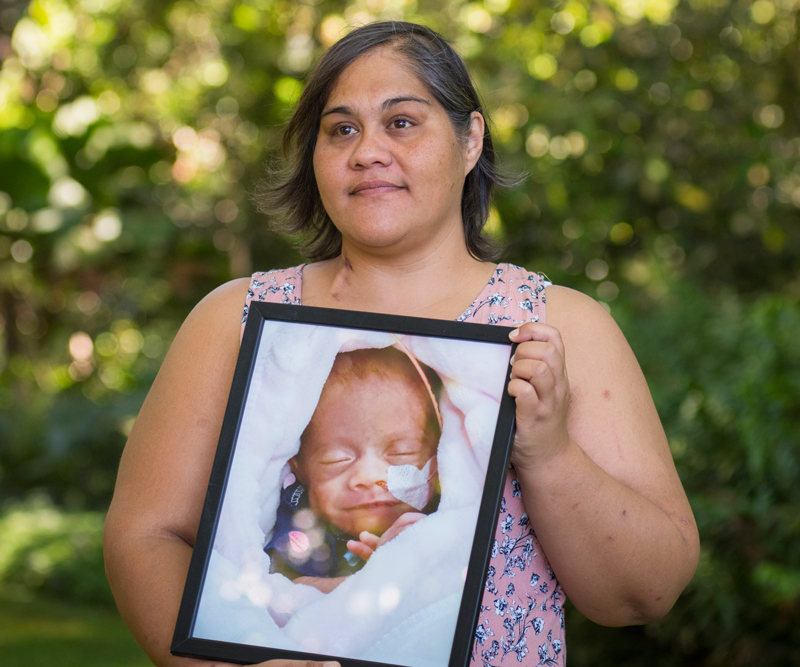 Cynthia Cruz's photo being held