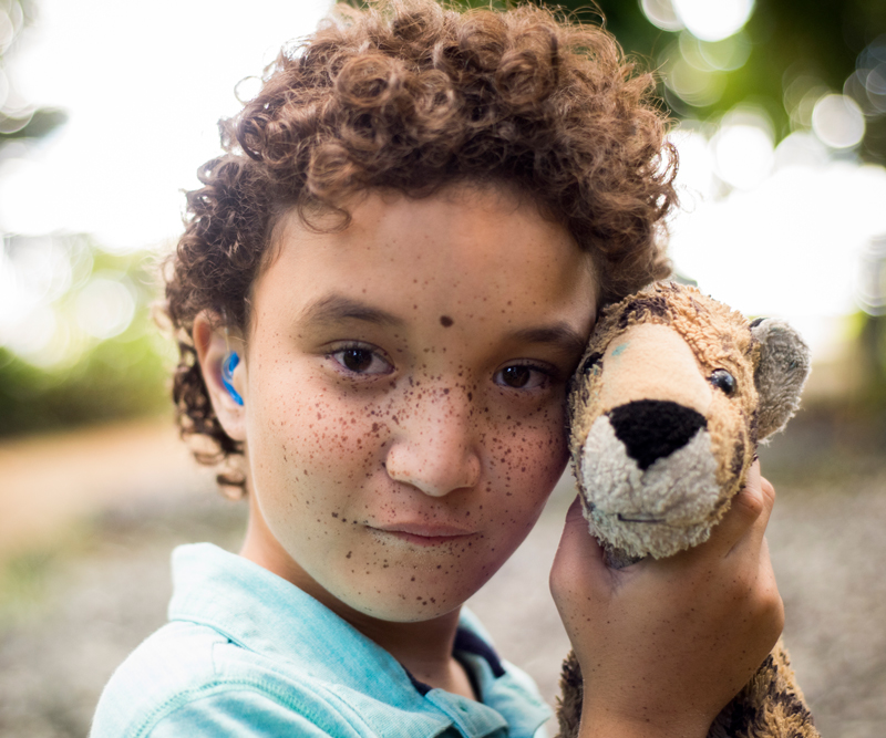 Kayle Osai holding plush lion