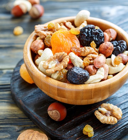Dried fruit may seem like a healthy snack, but some varieties can have as much as a day's worth of sugar in a single serving! Create a healthier treat by adding an ounce of nuts for protein, healthy fat and extra fiber, and watch portion sizes!