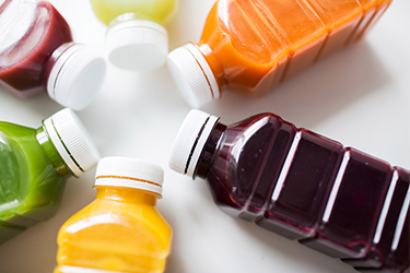 Various colored juice bottles