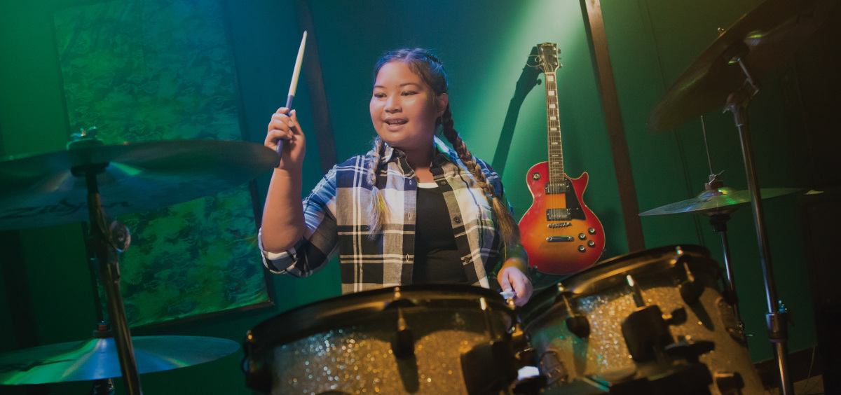 girl playing the drums