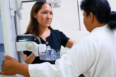 Doctor performing annual breast cancer screening test