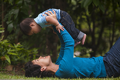 a man playing with his son