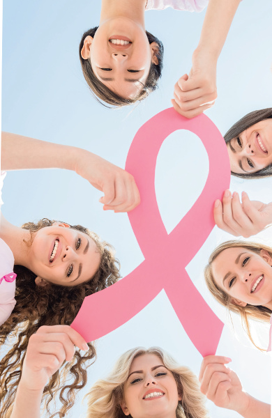 Five women holding a cancer ribbon together