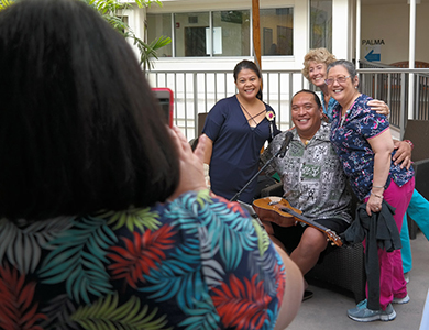 Cancer survivor taking a photo with his family