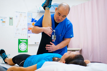 Woman getting physical therapy from her therapist