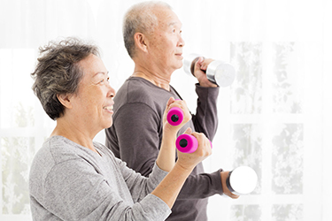 an elderly couple working out together