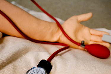 Patient getting blood pressure checked