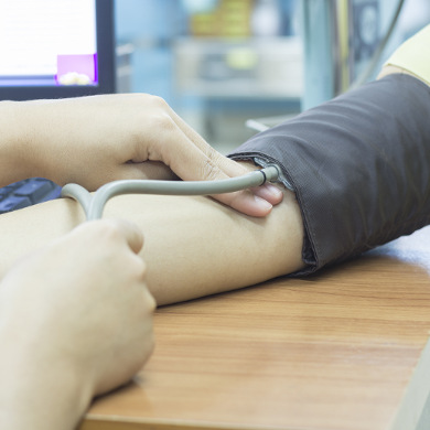 Doctor taking a patient's blood pressure