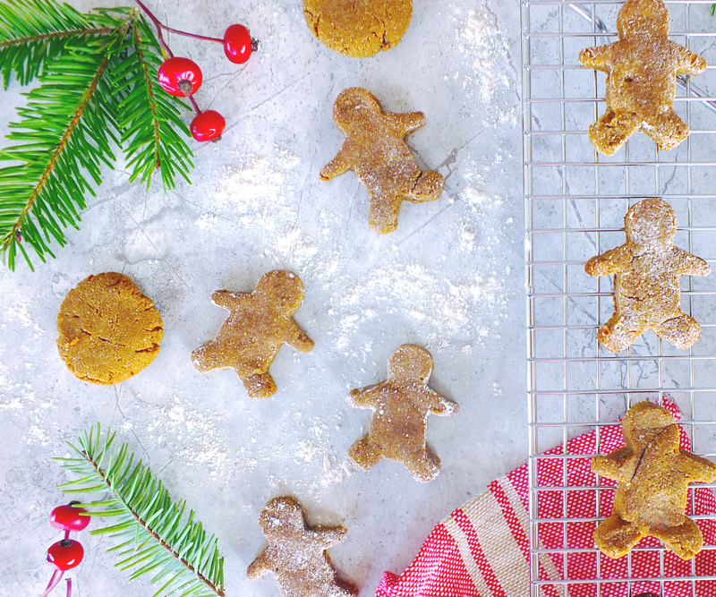 Gingerbread men on a table decorated for the holidays