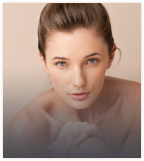 Woman with brown hair shown from head to shoulders