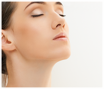 Face and Neck of a women with brown hair and closed eyes