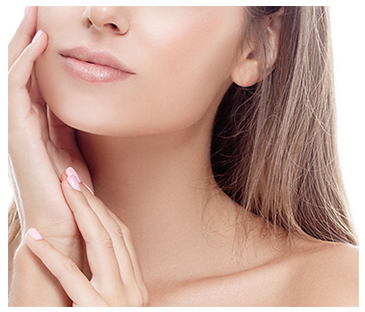 Lower face and neck of a women with brown hair touching her face