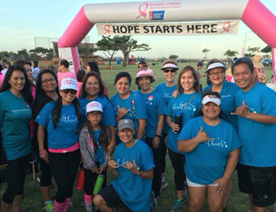 Group of Making Strides Walkers standing in front of finish line