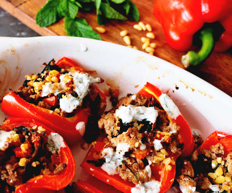 Turkey Masala Stuffed Peppers in a ceramic baking dish fresh out of the oven