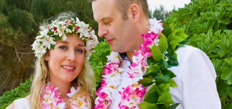 Young couple with lei at beach