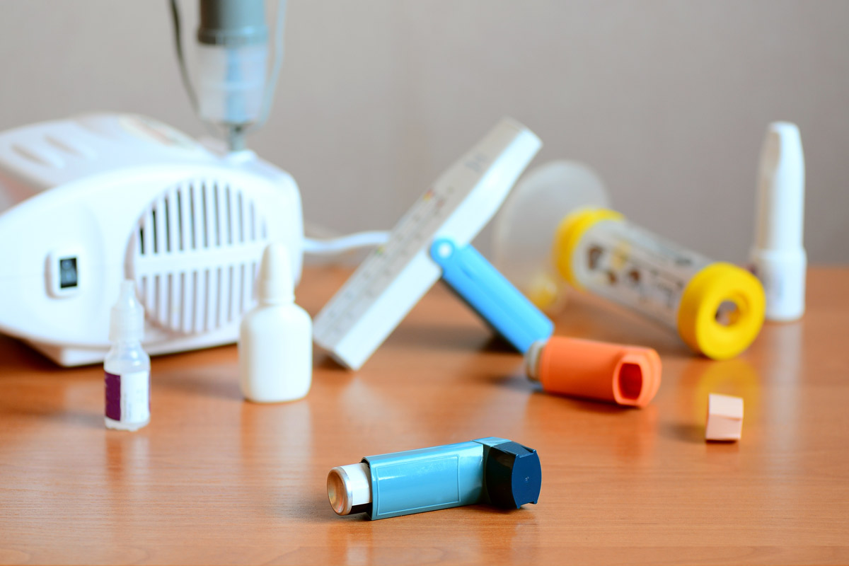 various asthma and allergy treatments on a wooden table