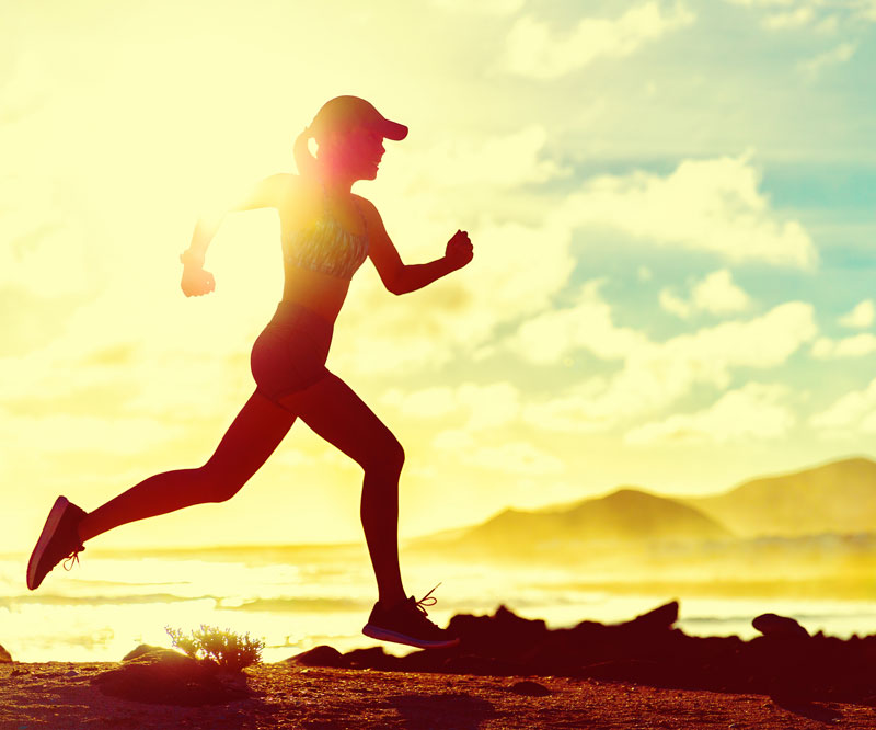 woman running by the beach