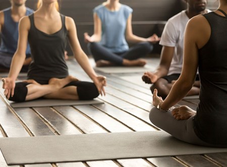 A good way to unwind during an 'active recovery' day is with a low-impact activity like yoga.