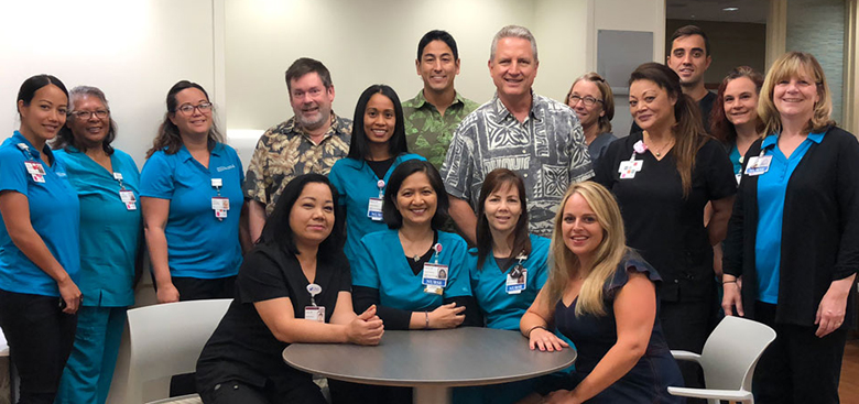 Hawaii News Now "Sunrise on the Road" reporters Dan Cooke, Steve Uyehara and Howard Dicus pose for a group shot with staff members from the Pali Momi Infusion Center