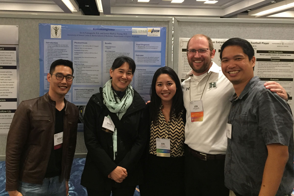 a group of people in front of a display at a convention