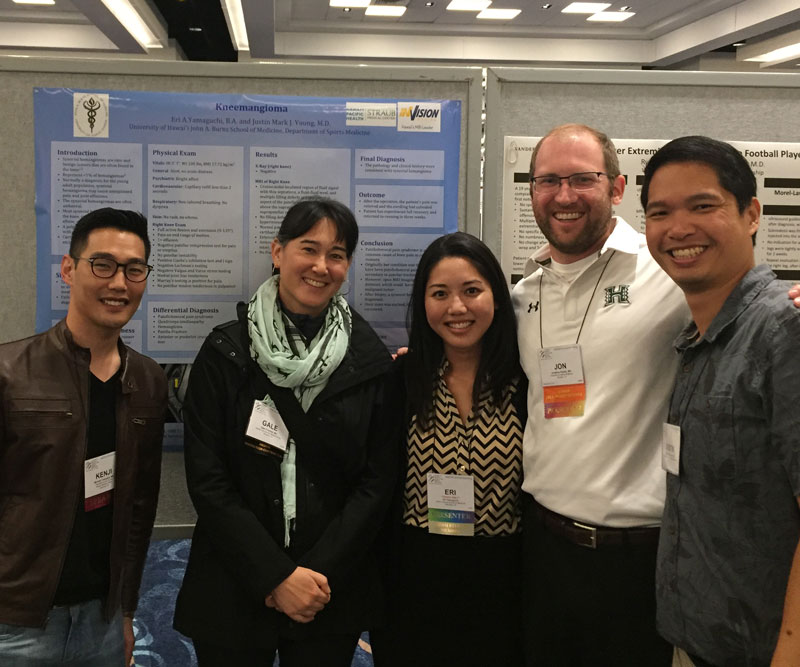 a group of people in front of a display at a convention