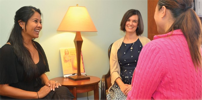 Women from the breast cancer support team sitting together and talking