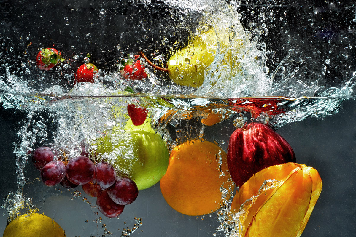 fruit being dropped into water