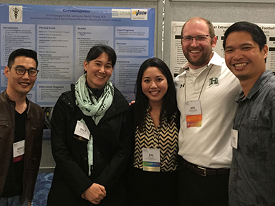 a group of people in front of a display at a convention