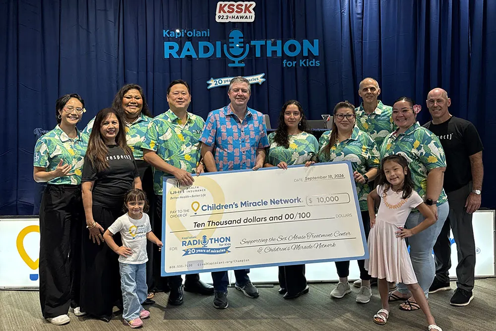 The team with the Sex Abuse Treatment Center receives a giant check for $10,000.