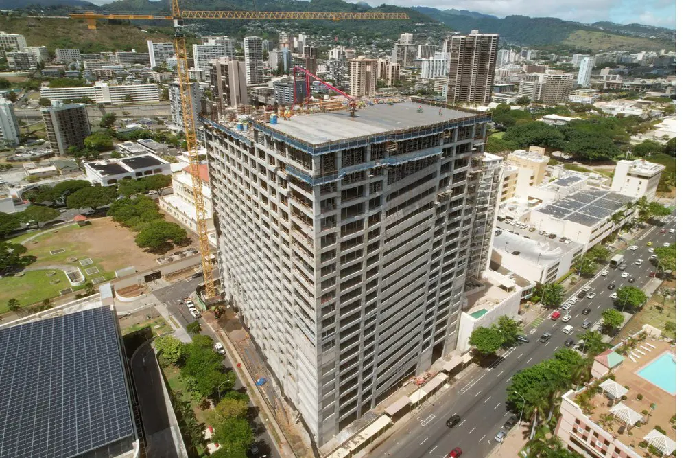 Aerial view of rooftop concrete work with the Koʻolau Range in the background.