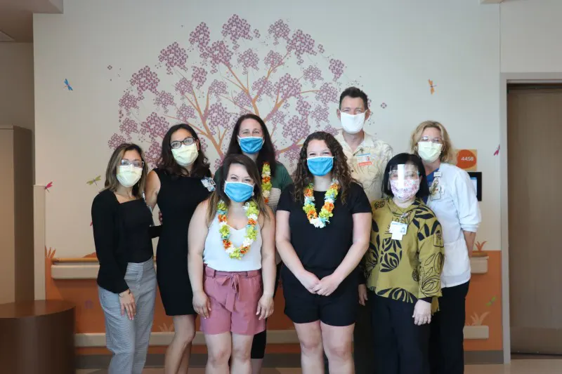 Group shot of healthcare providers wearing masks.