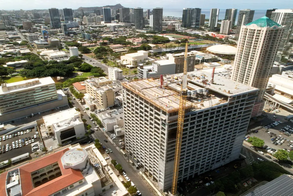 Wide aerial view of the parking building within central Honolulu.