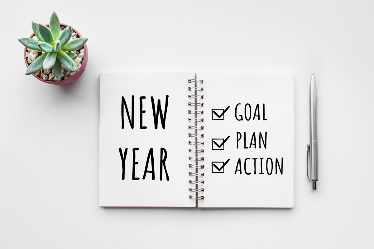 Planner with a checklist of goals, plan and action for the New Year.