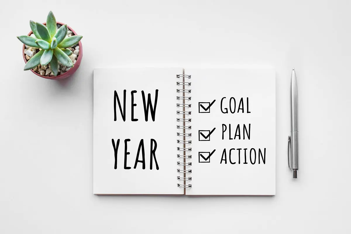 Planner with a checklist of goals, plan and action for the New Year.