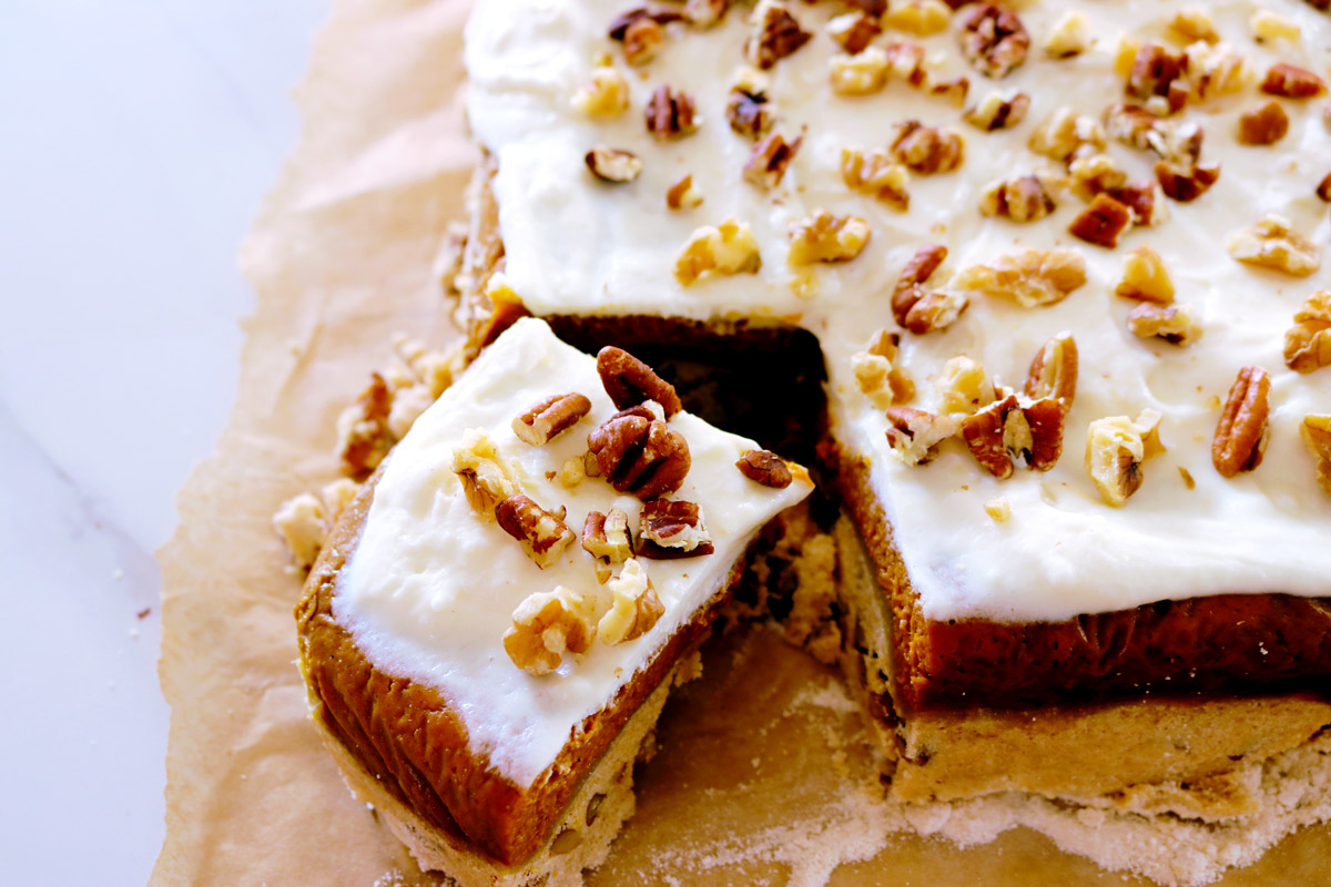 A side view of Pumpkin Crunch Cake with a large corner piece cut out.